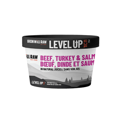 A tub labeled "Iron Will Raw Level Up" pet food, featuring beef, turkey, and salmon in natural juices. The label has English and French text, with a black lid and a mostly white and purple design.