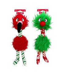 Two plush dog toys with long necks and quirky features. The left toy is red with a black beak and striped legs. The right toy is green with a round red nose and patterned legs. Both toys have fluffy textures and big eyes.