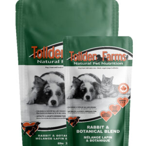 Two bags of pet food labeled "Tolldern Farms Natural Pet Nutrition" with images of a dog, cat, and rabbit. The products feature "Rabbit & Botanical Blend" and Canadian certification symbols. The packaging is green and white.