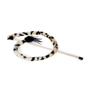 A cat toy with a long, beige and black striped fuzzy string attached to a wooden wand, featuring a small black feather near the end of the string, on a white background.