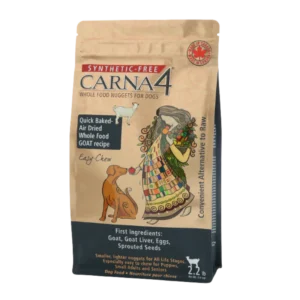 A bag of Carna4 Whole Food Nuggets for Dogs, featuring colorful artwork of a woman feeding a dog. The packaging highlights "synthetic-free," goat-based ingredients, and "quick baked air-dried" nuggets. 2.2 lb size.