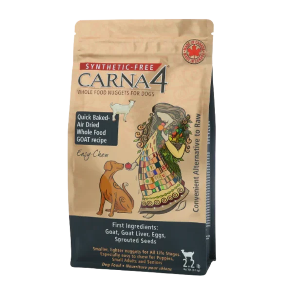 A bag of Carna4 Whole Food Nuggets for Dogs, featuring colorful artwork of a woman feeding a dog. The packaging highlights "synthetic-free," goat-based ingredients, and "quick baked air-dried" nuggets. 2.2 lb size.