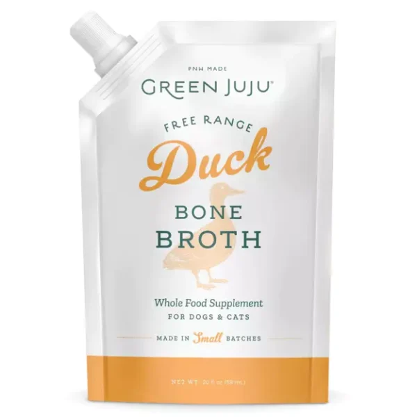 A white and gold pouch labeled "Green Juju Free Range Duck Bone Broth." It is a whole food supplement for dogs and cats, made in small batches. The pouch has a spout at the top left corner.