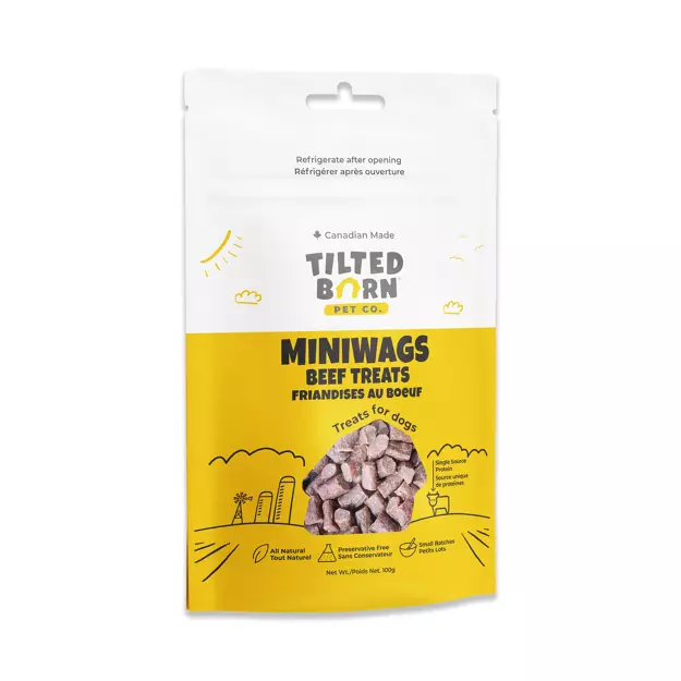 A resealable bag of Tilted Barn Pet Co. Miniwags Beef Treats for dogs. The white and yellow package shows an image of the treats and highlights features like all natural, protein-rich, and Canadian made.