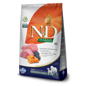 A bag of N&D Pumpkin dog food featuring images of pumpkin, raw lamb meat, and blueberries on its front. The packaging is white with orange and green accents, labeled for adult medium and maxi breeds.
