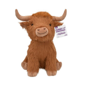 A brown, plush Highland cow toy with long fur, two curved horns, a smiling face, and a tag attached to its ear that says "multipet nob SQUEAK." The toy is sitting upright against a white background.