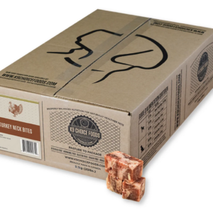 A cardboard box labeled "Turkey Neck Bites" from K9 Choice Foods sits on a white surface, with three frozen, cube-shaped pieces of turkey neck placed in front of it.
