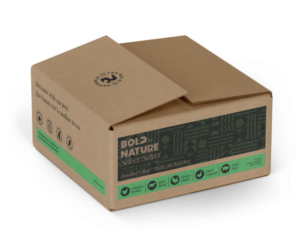 A brown, rectangular box is partially open. The box has the brand name "BOLD by Nature" printed on it along with phrases such as "Butcher's Box" and "Select." Symbols indicating product details like chicken, pork, beef, and meal type are also visible on the box.