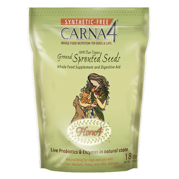 A green bag of CARNA4 Synthetic-Free Ground Sprouted Seeds for dogs and cats, featuring a drawing of a woman holding a cat and dog, and text highlighting live probiotics and enzymes.