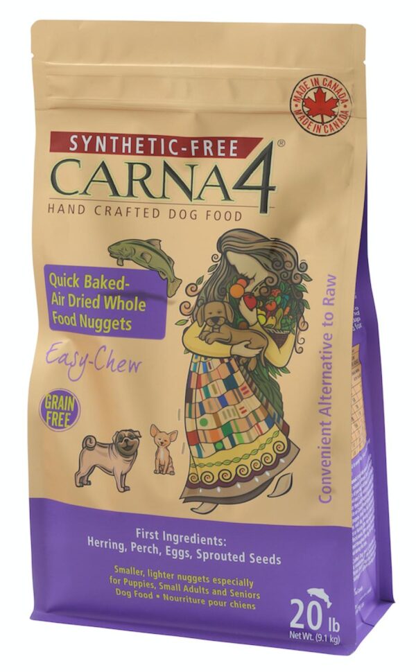 A 20 lb bag of Carna4 Synthetic-Free Hand Crafted Dog Food, featuring a woman holding a dog, product info, and claims like "Grain Free," "Easy Chew," and "Quick Baked-Air Dried Whole Food Nuggets.