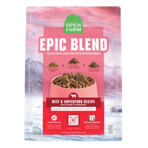 A pink and white bag of Open Farm Epic Blend dog food, labeled "Beef & Superfood Recipe" with images of beef morsels and liver pieces. The mountains and a farm are shown at the bottom of the package.