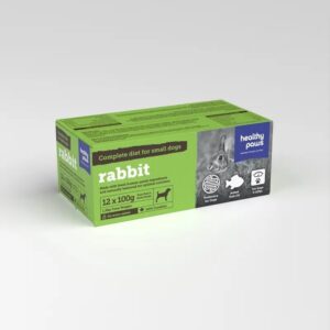 A green and purple box of Healthy Paws Rabbit Complete 12x100g for small adult dogs, featuring a rabbit image, grain-free icon, and product details.