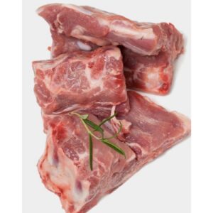 Three medium boar bones from Tollden Farms, weighing a total of 3lb, are stacked on a white background and garnished with a small sprig of rosemary.