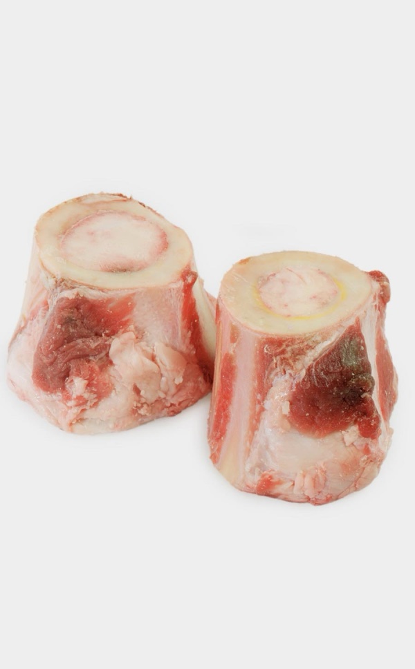 Two Tollden Farms Beef Marrow Bones Medium (3lbs) are displayed on a white background. The bones are cut crosswise, revealing the marrow inside and some attached meat on the outside.