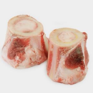 Two large Tollden Farms Beef Marrow Bones, weighing 3lbs and sliced crosswise to reveal dense bone and creamy marrow, along with visible red meat and fat on the outside, set against a plain white background.