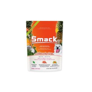 A 2.5 kg bag of Smack Caribbean -Salmon Fusion for Dog, showcasing vibrant orange and yellow packaging with tropical fruit graphics and a cheerful white dog. The label highlights the Caribbean-Salmon flavor along with key ingredients and product details.
