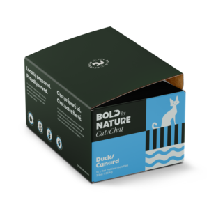 A green and blue box of Bold Nature Duck For Cat 3lbs cat food, featuring a white cat illustration and labeled “Duck/Canard.” The packaging highlights local preparation and other product details.