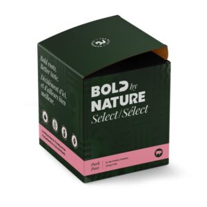 A green box of Bold by Nature Select - Frozen Raw Pork Dog Food 4 lbs, partially open, displays bilingual text and icons on its side.