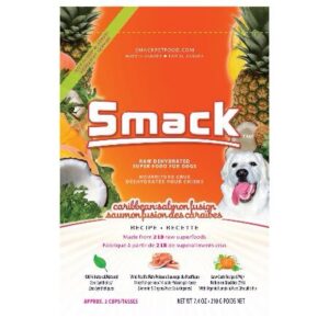 Front of a Smack Caribbean-Salmon Fusion for Dog 210 gr bag featuring a white dog, pineapples, and oranges. Text highlights the Caribbean-Salmon Fusion flavor—raw dehydrated dog food made with raw superfoods. Net weight: 210g (7.4 oz).