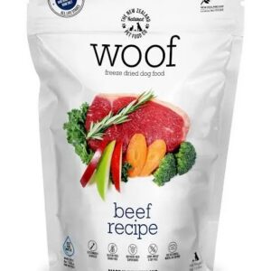 A 50g bag of Freeze Dried Woof Beef dog food, featuring a beef recipe. The packaging displays images of beef, carrots, broccoli, and rosemary, along with “Made in New Zealand” and certification logos at the top.