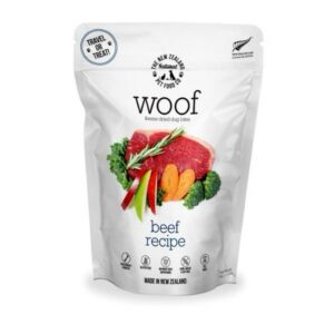 A 50g pouch of Freeze Dried Woof Beef featuring an image of a raw steak with carrots, broccoli, and a sprig of rosemary.