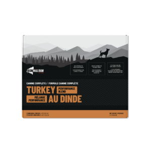 Iron Will Raw Canine Complete Turkey & Beef Dinner 6 lbs box, featuring a graphic of a dog in a mountain landscape and text detailing protein and vitamin content.