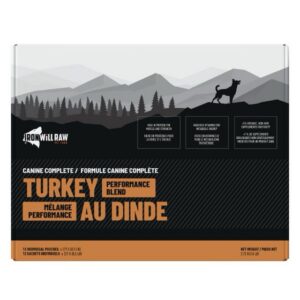 12 lbs box of Iron Will Raw Canine Complete Turkey & Beef dog food, featuring a mountain landscape, a dog silhouette, and “Turkey Performance Blend” labeling in English and French.