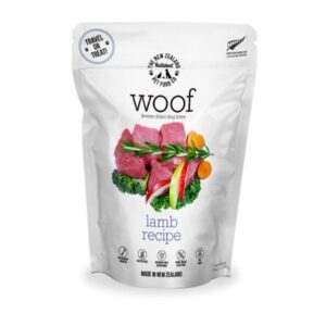 A stand-up pouch of Woof Freeze Dried Dog Bites Lamb 50g featuring an image of raw lamb, broccoli, and apple slices.