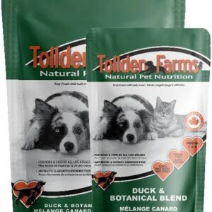 Two green pouches of Tollden Farms Duck & Botanical 8 lb raw pet food, featuring a dog and a cat on the labels.