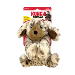 A plush dog toy with brown and white fur, floppy ears, and blue eyes. It is part of the KONG Toughz series, labeled as a durable squeaky toy. The packaging features the words "squeaks" and "durable plush.