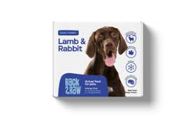 A box of Back2Raw Lamb & Rabbit 12lbs (Basic) pet food with a brown dog image, labeled "Lamb & Rabbit," and icons highlighting natural, Canadian, and raw ingredients.