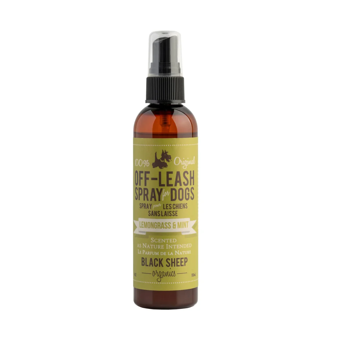 A brown spray bottle labeled "Off-Leash Spray for Dogs" in lemongrass and mint scent by Black Sheep Organics, with a black spray nozzle and yellow label.