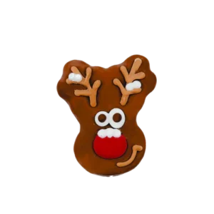 A reindeer-shaped gingerbread cookie with white eyes, a red nose, and brown antlers decorated with white icing.