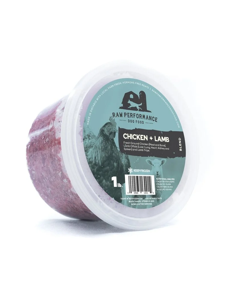 A 1-pound tub of Raw Performance Dog Food, Chicken + Lamb blend, with a translucent lid and a green label featuring a chicken illustration and product details. The food inside is visibly ground and reddish in color.