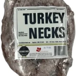 A vacuum-sealed package labeled "Turkey Necks" containing several raw turkey necks. The label includes ingredients, a barcode, and contact information for the manufacturer.