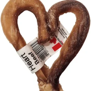 A twisted beef dog treat shaped like a heart, with a label attached reading "Heart Beef." The treat is light brown with darker brown areas.