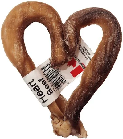 A twisted beef dog treat shaped like a heart, with a label attached reading "Heart Beef." The treat is light brown with darker brown areas.