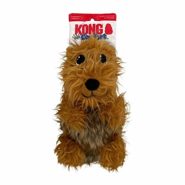 A brown, plush dog toy with black eyes and nose, made by KONG, a brand known for pet products. The toy has a fuzzy, textured appearance, and is still attached to its red and white packaging.