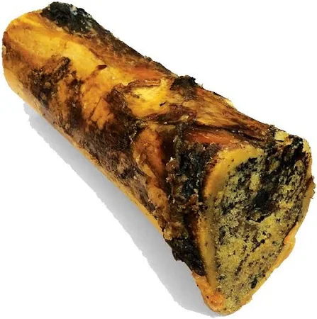 A close-up of a single marrow bone, showing its rough, textured surface. The bone has a natural coloration with dark spots and a hollow center, suggesting it might be used for cooking or as a dog treat.