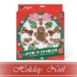 A festive cookie decorating kit with a large gingerbread person, mini gingerbread cookies, and decorated cookies shaped like stockings and Christmas trees. The packaging is red and green with a pink bow and reads “Punky Cookies.”.