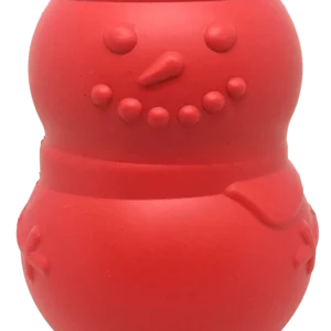 A red, rubber snowman-shaped toy with dotted eyes, a carrot-shaped nose, smile, and buttons. It's simple and smooth, resembling a festive winter figure with minimalistic features.