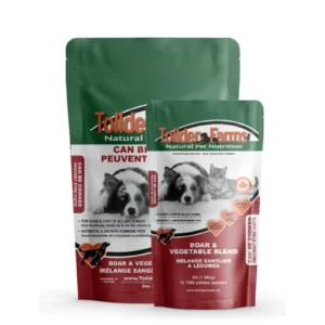 Two packages of Tollden Farms pet food, labeled "Boar & Vegetable Blend." The larger bag features images of a dog and a cat and text highlighting its suitability for all life stages. Both bags are green and red.