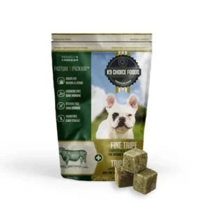 A package of K9 Choice Fine Ground Tripe 3 lbs dog food featuring a French Bulldog and three cubes of the food displayed in front. The packaging is green, gold, and white, displaying product information and an image of a cow.