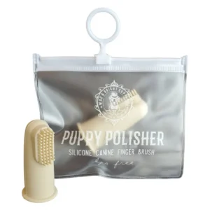 A beige silicone canine finger brush and a transparent pouch labeled "Puppy Polisher Silicone Canine Finger Brush, BPA free," featuring a logo with a dog illustration.